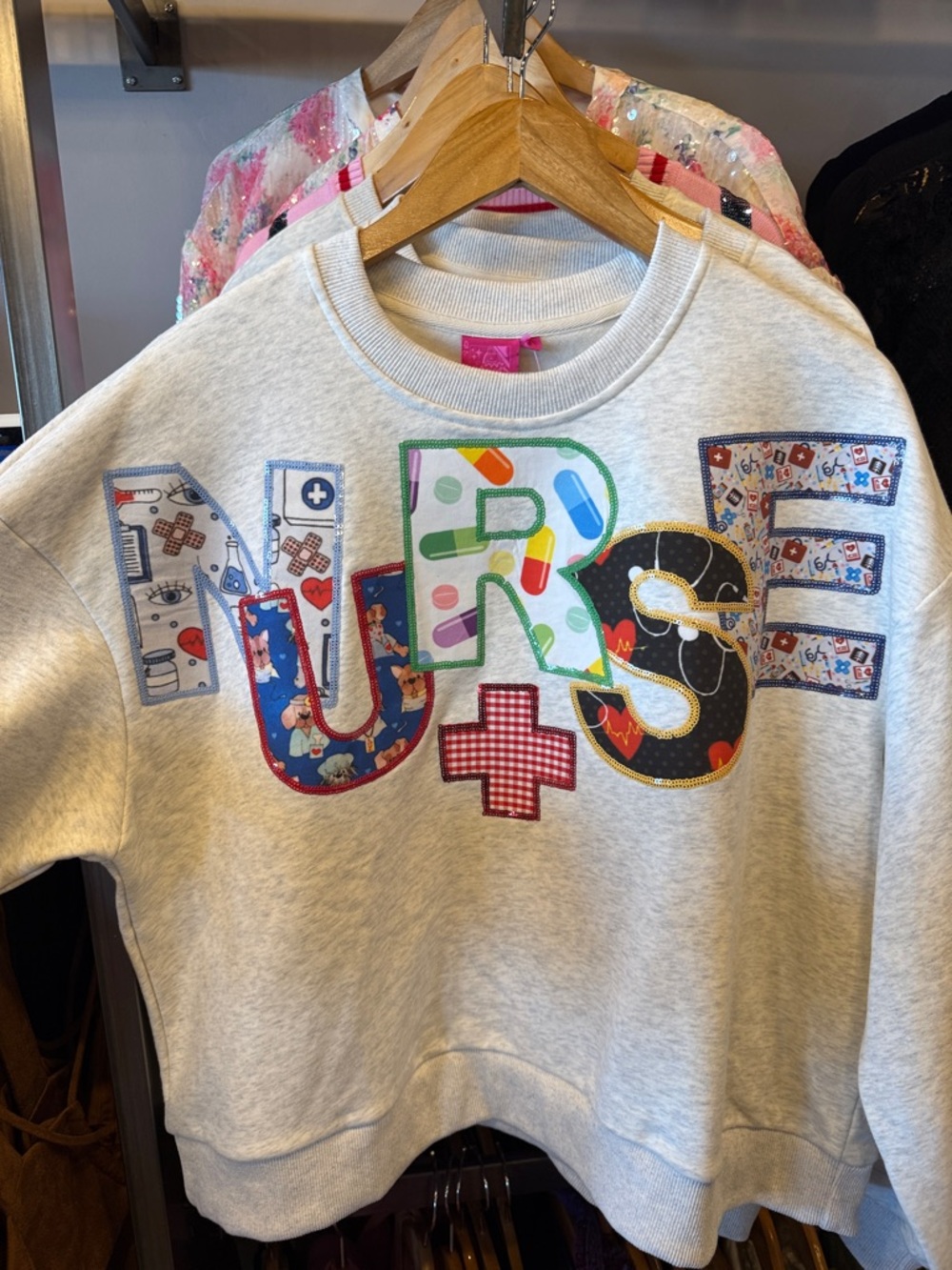 QUEEN OF SPARKLES Grey Patchwork “NURSE” Sweatshirt